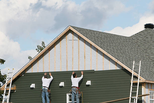 Professional Storm Damage Siding Repair technician working in Baldwin, PA